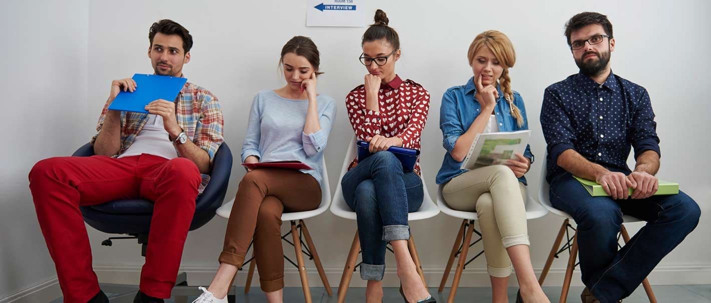 The picture shows young unemployed Europeans waiting for their job interview.